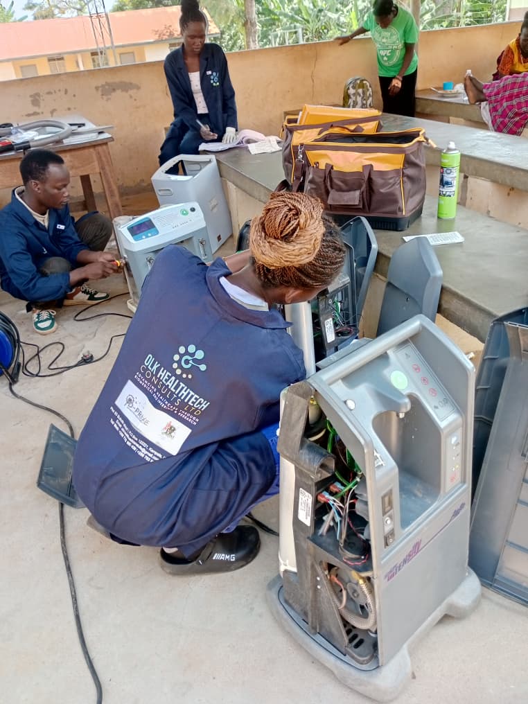 OLK HealthTech engineers repairing oxygen concentrators at Tororo